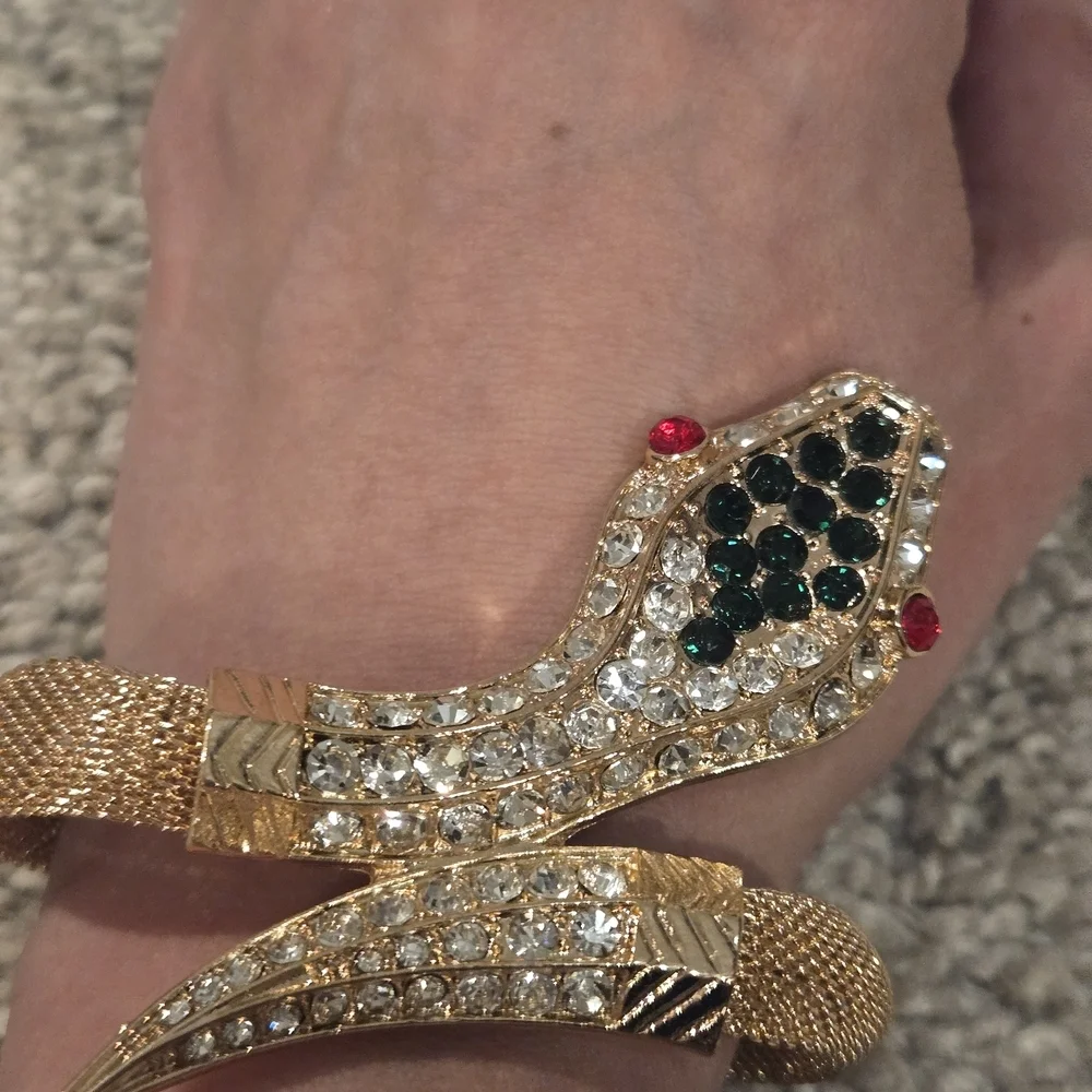 Elegant Gold Snake Bracelet with Green and Red Accents